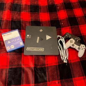 Sony PlayStation Console with Black and White Controllers